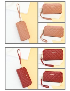 Detail view of quilted leather clutch wallets with wristlet straps and gold zippers