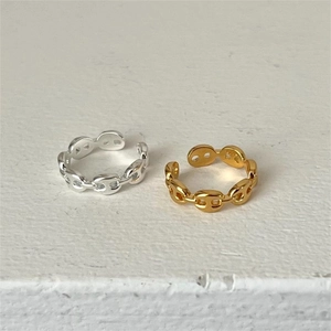 Detail showing gold and silver S925 sterling silver chain rings with pig nose design
