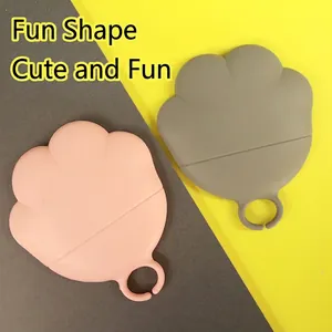Multifunctional cat claw silicone food spoon for pet canned lids in pink and grey colors