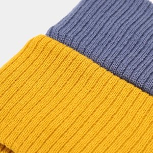 Two-tone ribbed knit headband in mustard yellow and blue for sports and yoga