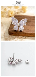 Detailed back view of a butterfly earring with purple zircon and a threaded screw back