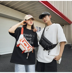 Outdoor street style shot of models wearing white-orange and black nylon cross-body bags