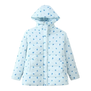 Detail of light blue hooded puffer jacket with floral pattern and quilted texture