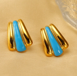 Detail of 18k gold plated stainless steel leaf earrings with light blue enamel inlay