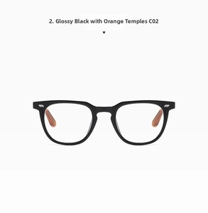 Detail of square glasses frame with glossy black front and orange temples with rivets