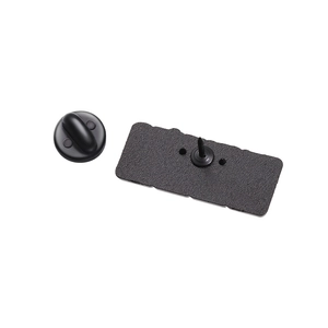 Detailed back view of a black metal pin badge with a matching durable rubber clutch accessory