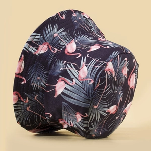 Reversible bucket hat with flamingo and palm leaf print in deep blue and pink colors