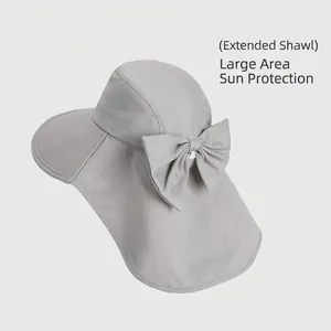 Women's sun hat with wide brim, neck protective shawl and bow detail in light gray