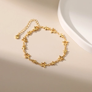 Detail of 18K gold plated star bracelet with lobster clasp and adjustable extension chain