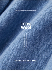 Macro detail of 100% blue wool knitted fabric showing soft texture and premium fibers