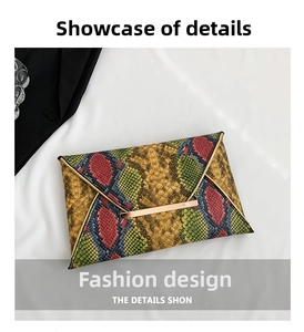 Close-up of multicolor snakeskin envelope clutch with elegant champagne gold metal clasp