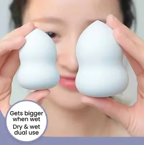 Light blue teardrop makeup sponge showing water expansion for wet and dry use