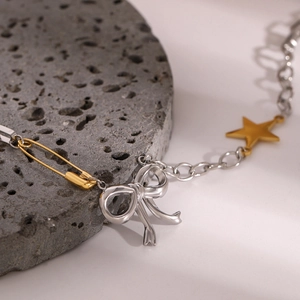Collar bicolor de acero inoxidable con lazo, imperdible dorado y colgante de estrella