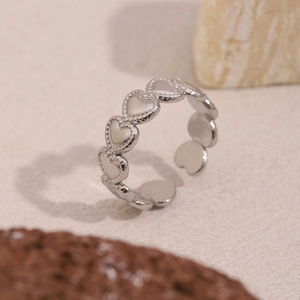Detailed view of silver heart chain link open ring with polished metal texture
