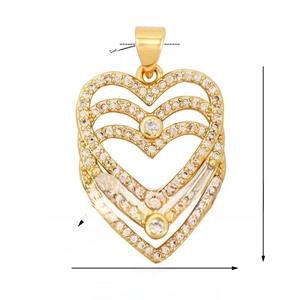 Macro shot of gold plated heart pendant with detailed dimensions and zircon inlay details