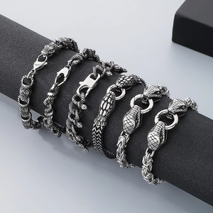 Detail showing vintage snake head bracelets in antique silver finish for men