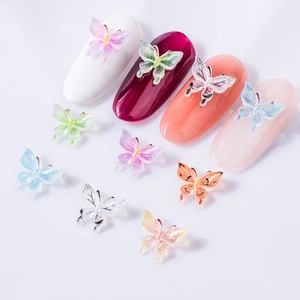3D butterfly nail charms in various gradient resin colors with glitter finish on display