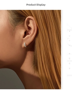 Close-up of S925 sterling silver hoop earrings with pavé set moissanite on model ear