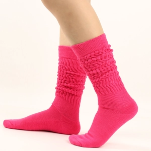 Detailed knit texture of hot pink slouch socks with thick ribbed thermal material