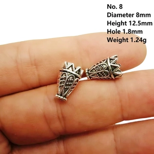 Close-up of 8mm antique silver alloy hollow heart floral beads for DIY jewelry