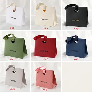 Elegant gift paper bags with litchi texture and silk ribbon handles in various colors