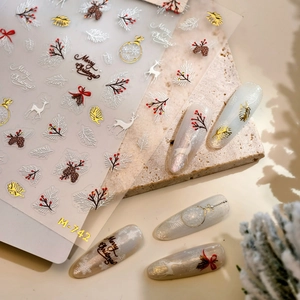 Exquisite Christmas nail stickers M-742 featuring white reindeer and snowflake patterns