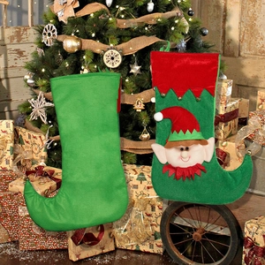 Christmas elf gift stockings in red and green felt for holiday party tree decorations