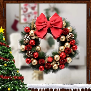 Christmas wreath with red bows, pine cones, and gold ornaments on a dark wood background