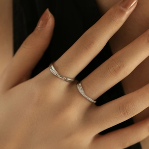 S925 sterling silver Mobius rings set with sparkling zircons worn on model fingers