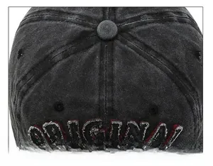 Macro view of stitching on washed denim cap with 3D embroidery detail