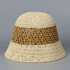 Close-up of handmade hollow knit bucket hat featuring two-tone straw texture detail