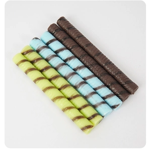Macro detail of spiral textured PVC chocolate bar props in macaron green, blue, and brown