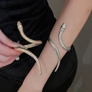 Gothic style snake-shaped wrap bracelet in gold and silver finish with scale texture