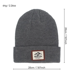 Dark grey ribbed knit beanie with mountain patch, dimensions 20x20cm and 64g weight