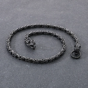 Close-up of black matte dragon head clasp and 6mm Byzantine chain in gothic steel style