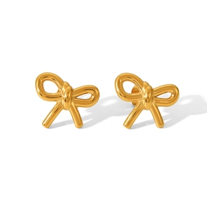 Macro shot of 18K gold plated stainless steel bow stud earrings with polished finish