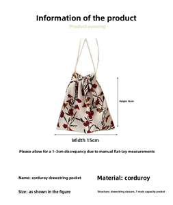 Detailed view of floral corduroy drawstring pouch showing 16x15cm dimensions and pattern