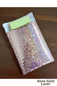 Detailed view of rose gold holographic bubble mailer with secure self-seal adhesive strip