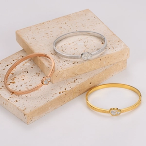 Three-piece frosted stainless steel bangles set with sparkling double heart charms