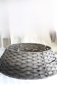 Detail of hand-woven wicker Christmas tree collar base with grey-brown rattan texture