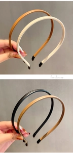 Detail shot of thin PU leather headbands showing fine texture and protective ends
