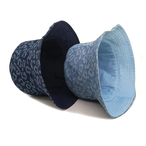 Deep blue and light blue leopard print denim bucket hats in a stylish sun protection design