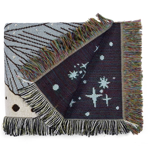Detail of bohemian woven blanket with stars and butterfly patterns and fringes