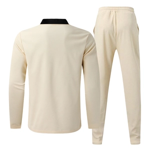 Back view of cream waffle knit tracksuit with black contrast collar and elastic waistband