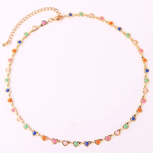 Detail of gold heart necklace with colorful enamel links and lobster clasp closure