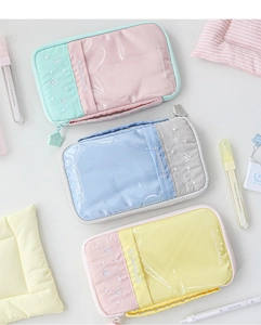 Three multi-color macaron stationery bags with transparent PVC windows and house-shaped zippers