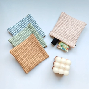 Hand-woven PU leather squeeze top mini pouch for cosmetics and digital cables