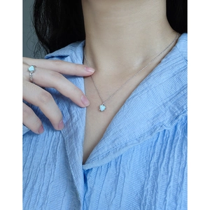 Elegant S925 silver heart opal ring and necklace set with textured finish worn on model