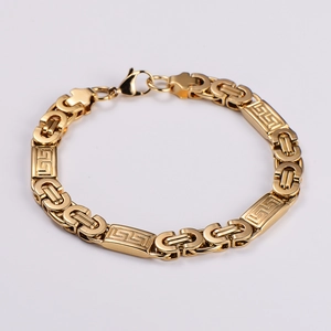 Detail of golden Byzantine chain bracelet featuring Greek key patterns and lobster clasp