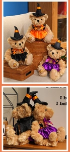 Detail of Halloween teddy bear plush with witch hat and pumpkin pattern on feet